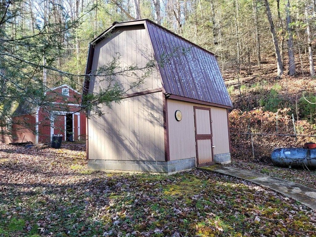 145 Crawford Stiles Road Farner, TN 37333 - Photo 19 of 45 a backyard of a house with lots of green space