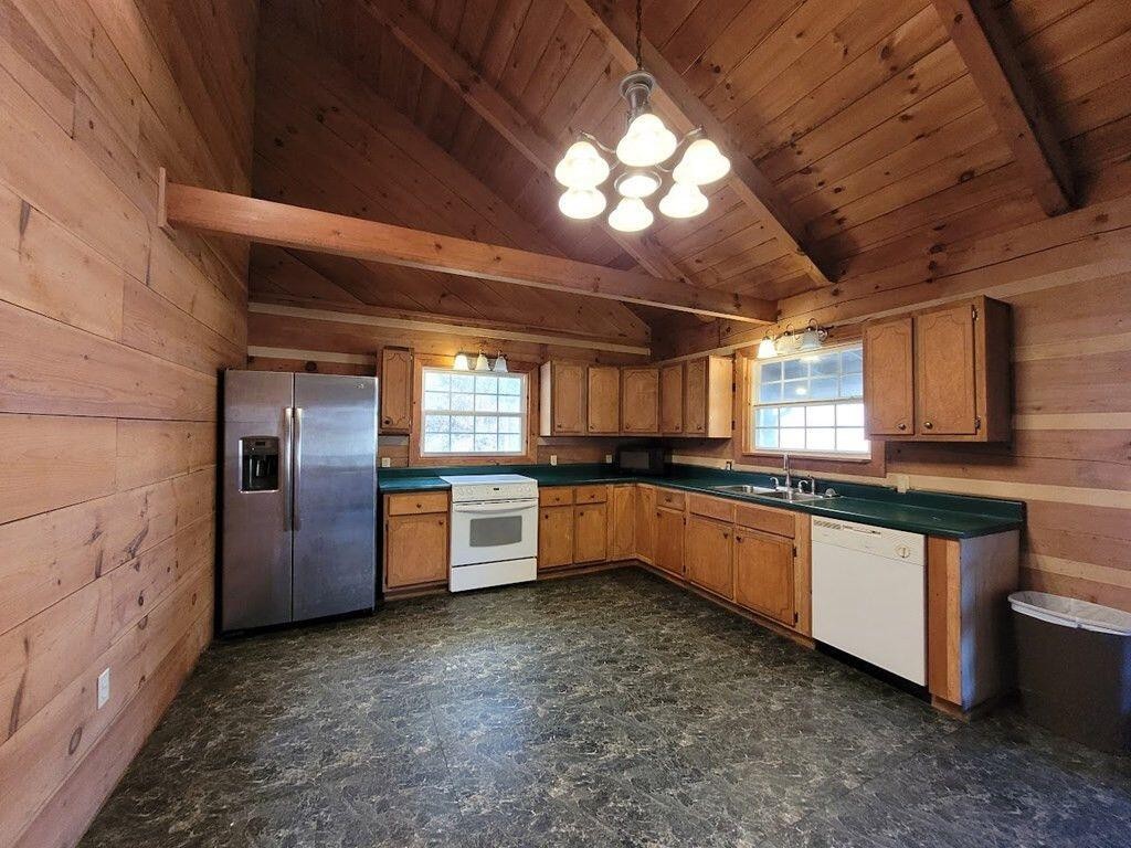 145 Crawford Stiles Road Farner, TN 37333 - Photo 2 of 45 a large kitchen with a large counter top space a sink stainless steel appliances and cabinets