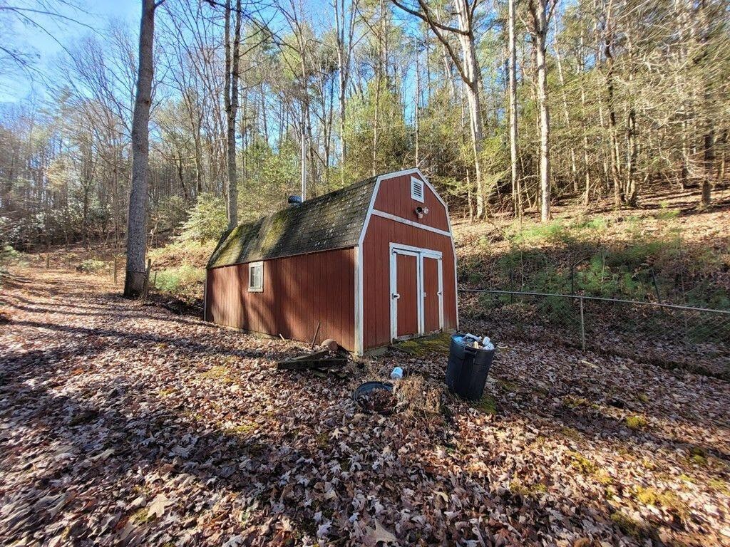 145 Crawford Stiles Road Farner, TN 37333 - Photo 22 of 45 a backyard of a house with lots of green space