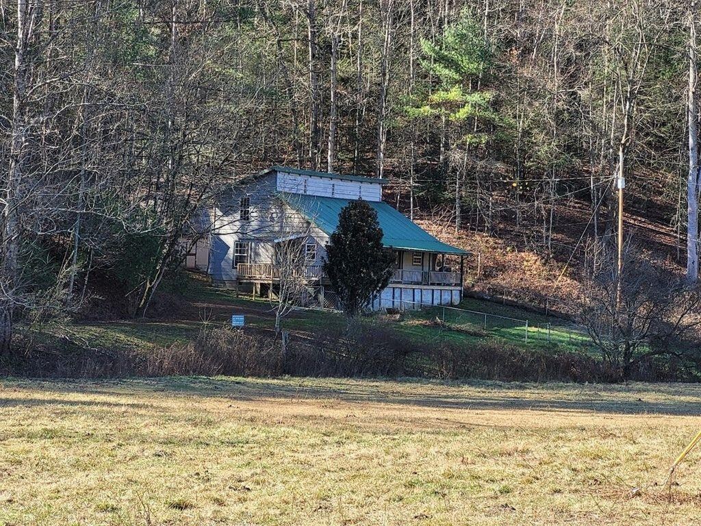 145 Crawford Stiles Road Farner, TN 37333 - Photo 27 of 45 a view of a house with a yard