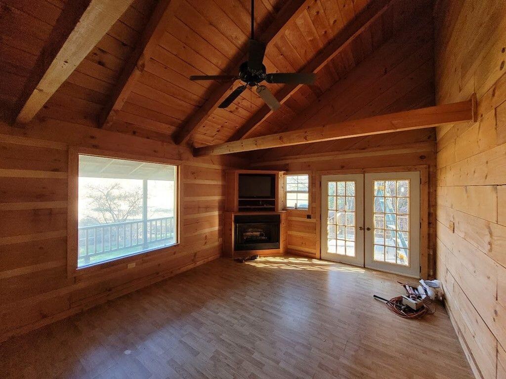 145 Crawford Stiles Road Farner, TN 37333 - Photo 3 of 45 a view of an empty room with wooden floor and a window