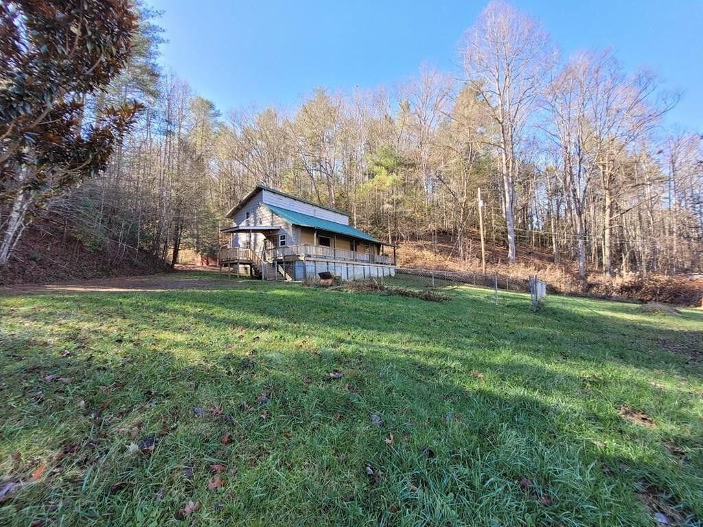 145 Crawford Stiles Road Farner, TN 37333 - Photo 43 of 45 a backyard of a house with lots of green space