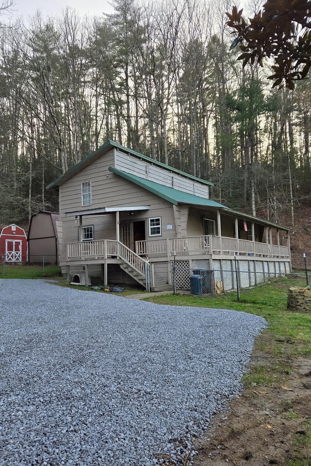 145 Crawford Stiles Road Farner, TN 37333 - Photo 44 of 45 a house that has a tree in front of a house