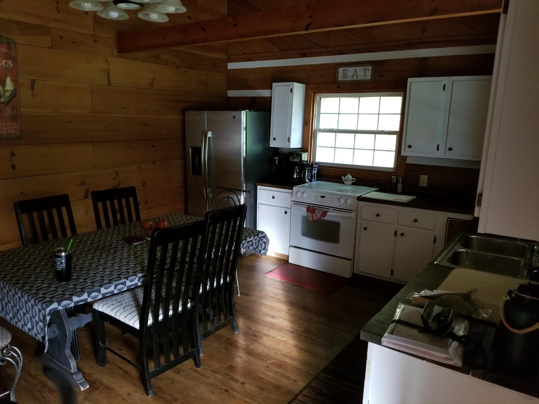 145 Crawford Stiles Road Farner, TN 37333 - Photo 5 of 45 a kitchen with granite countertop a stove a sink and a refrigerator