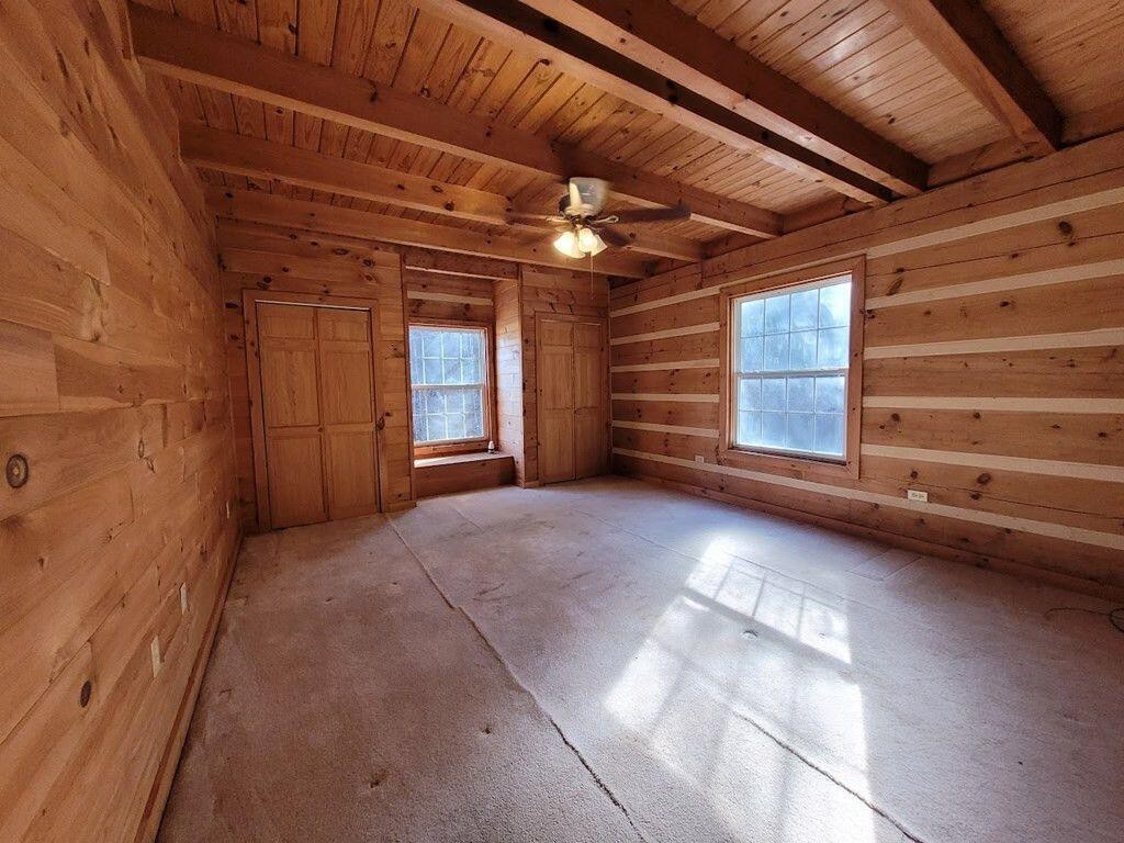 145 Crawford Stiles Road Farner, TN 37333 - Photo 8 of 45 a view of an empty room with a fireplace and a window