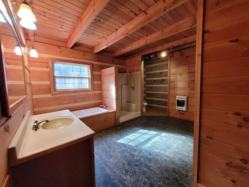 145 Crawford Stiles Road Farner, TN 37333 - Photo 9 of 45 a bathroom with a sink and a bathtub