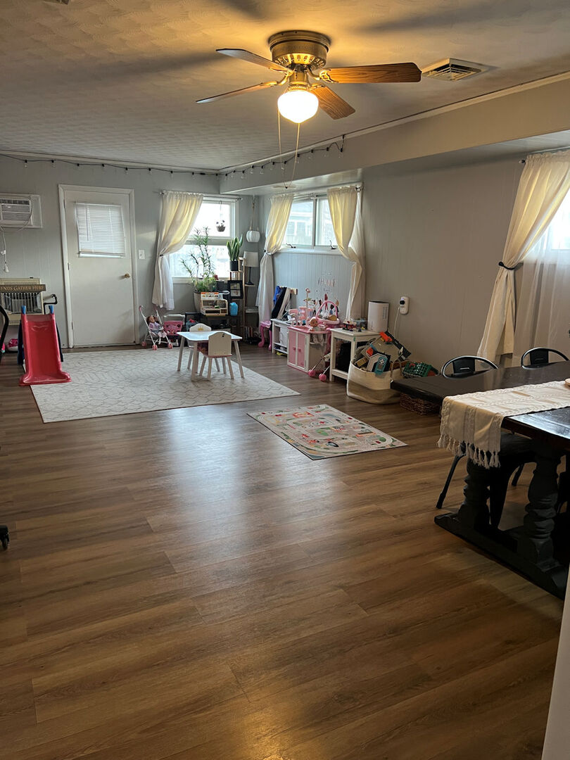 1170 Westview Drive Rochelle, IL 61068 - Photo 6 of 12 a living room with furniture and a chandelier
