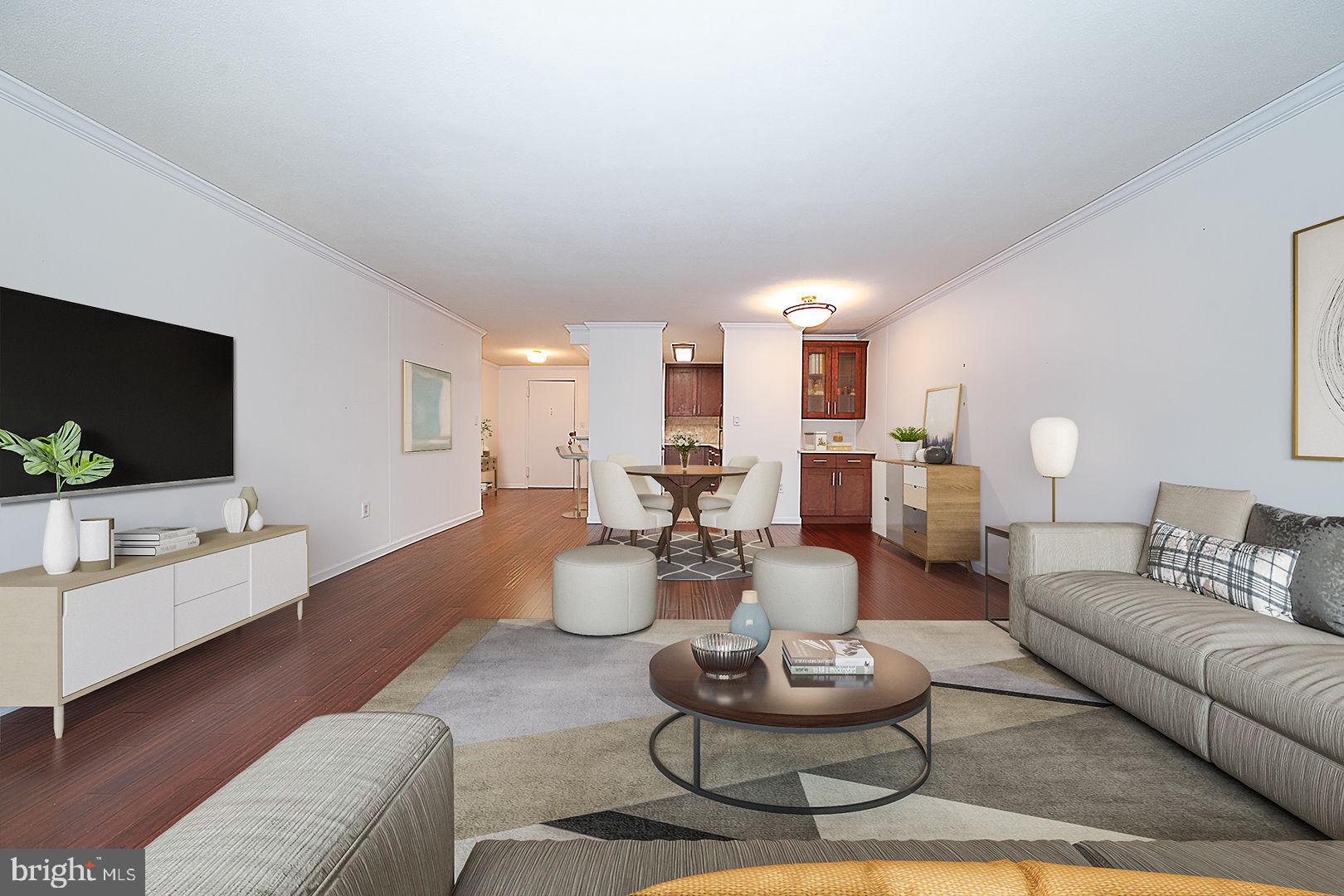 1919 Chestnut Street, Unit 1722 Philadelphia, PA 19103 - Photo 3 of 26 a living room with furniture and a flat screen tv