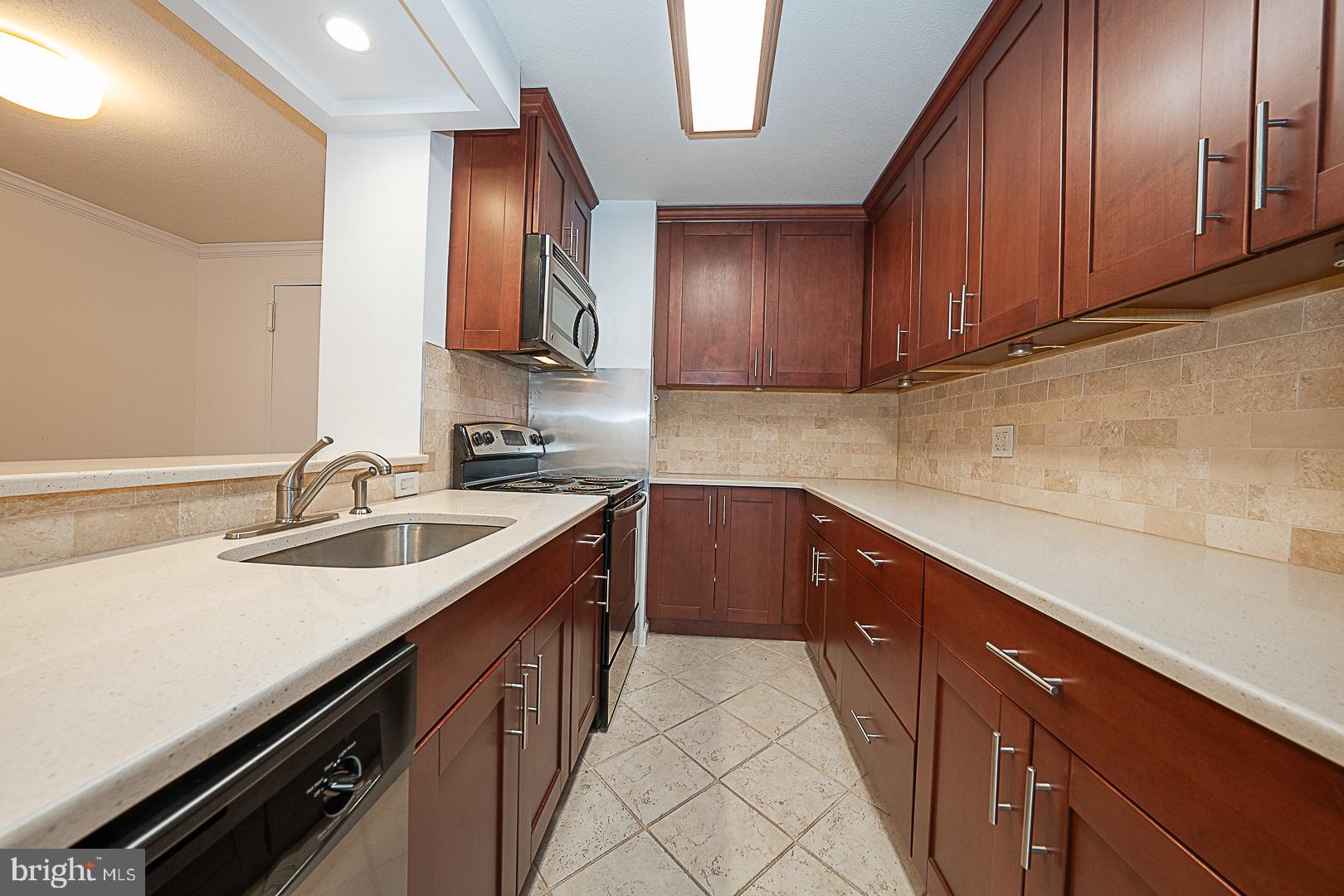 1919 Chestnut Street, Unit 1722 Philadelphia, PA 19103 - Photo 5 of 26 a kitchen with a sink and cabinets