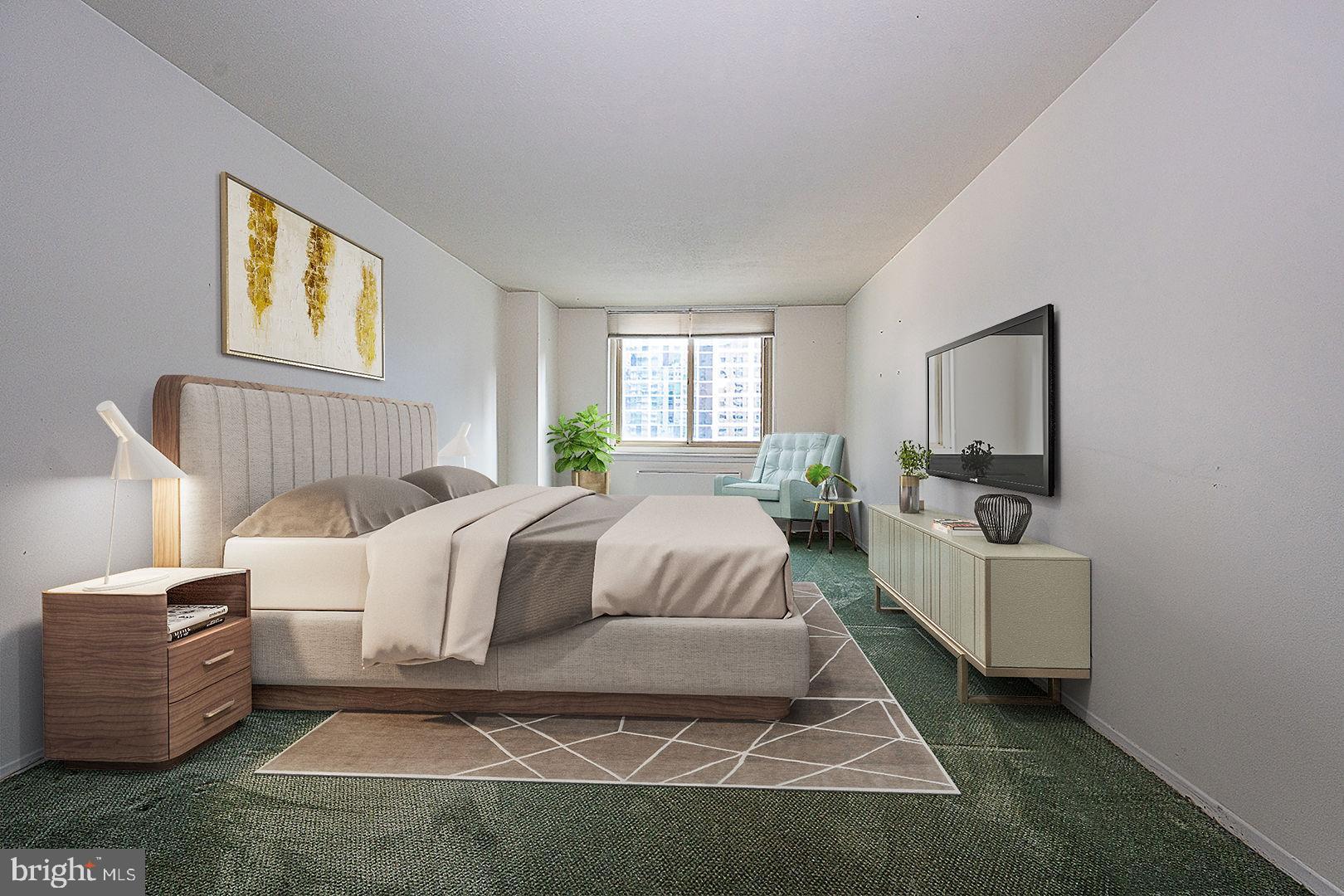 1919 Chestnut Street, Unit 1722 Philadelphia, PA 19103 - Photo 9 of 26 a spacious bedroom with a bed a couch and windows