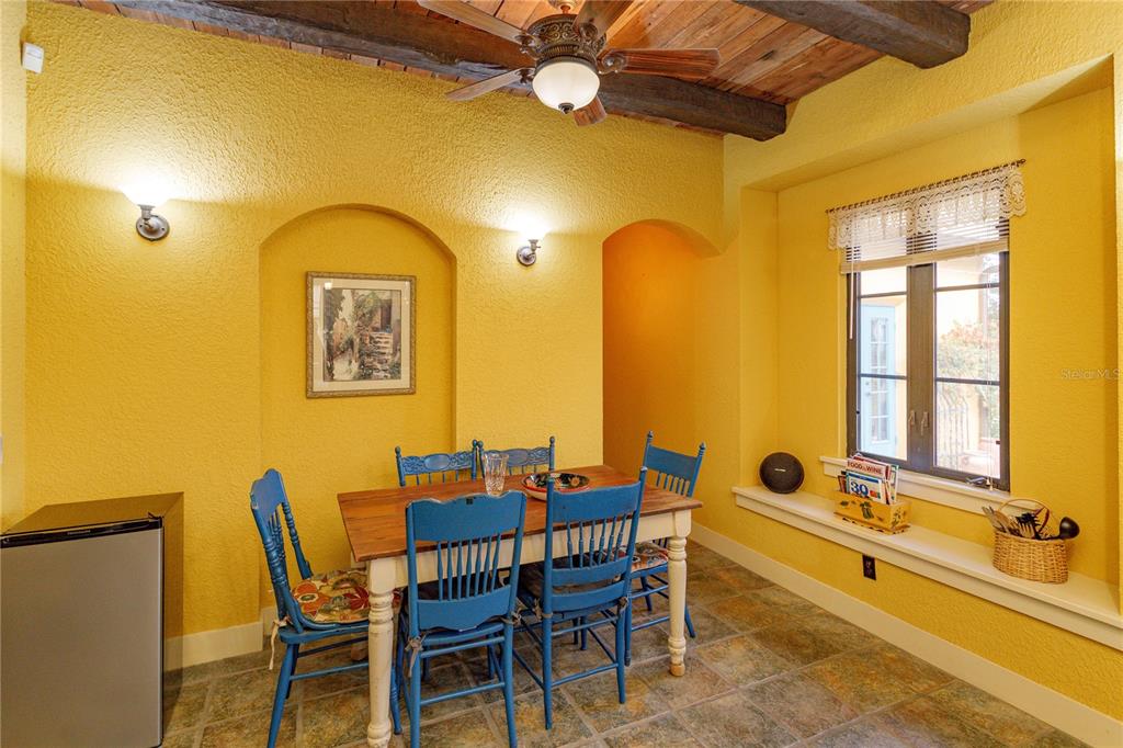 24540 Turkey Lake Road Howey-in-the-Hills, FL 34737 - Photo 12 of 42 a view of a dining room with furniture and a chandelier
