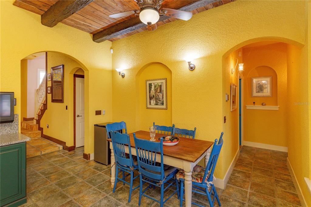 24540 Turkey Lake Road Howey-in-the-Hills, FL 34737 - Photo 13 of 42 a dining room with furniture and wooden floor