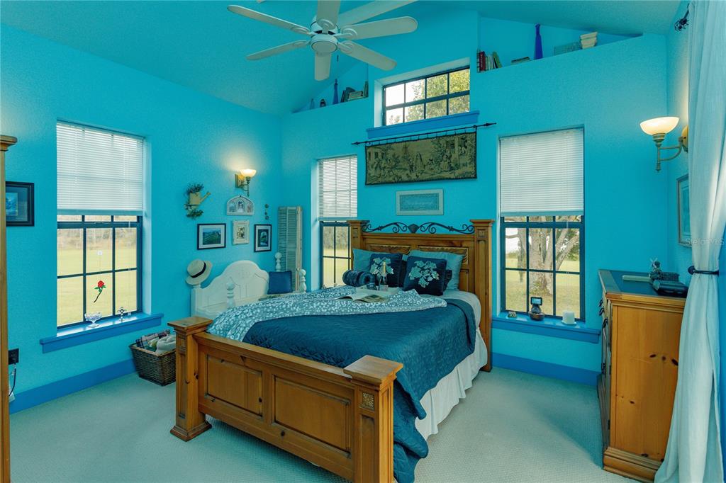 24540 Turkey Lake Road Howey-in-the-Hills, FL 34737 - Photo 19 of 42 a bed room with a bed and a window