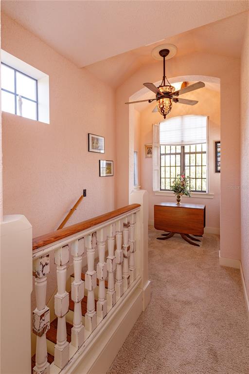 24540 Turkey Lake Road Howey-in-the-Hills, FL 34737 - Photo 26 of 42 a spacious bedroom with a bed and window