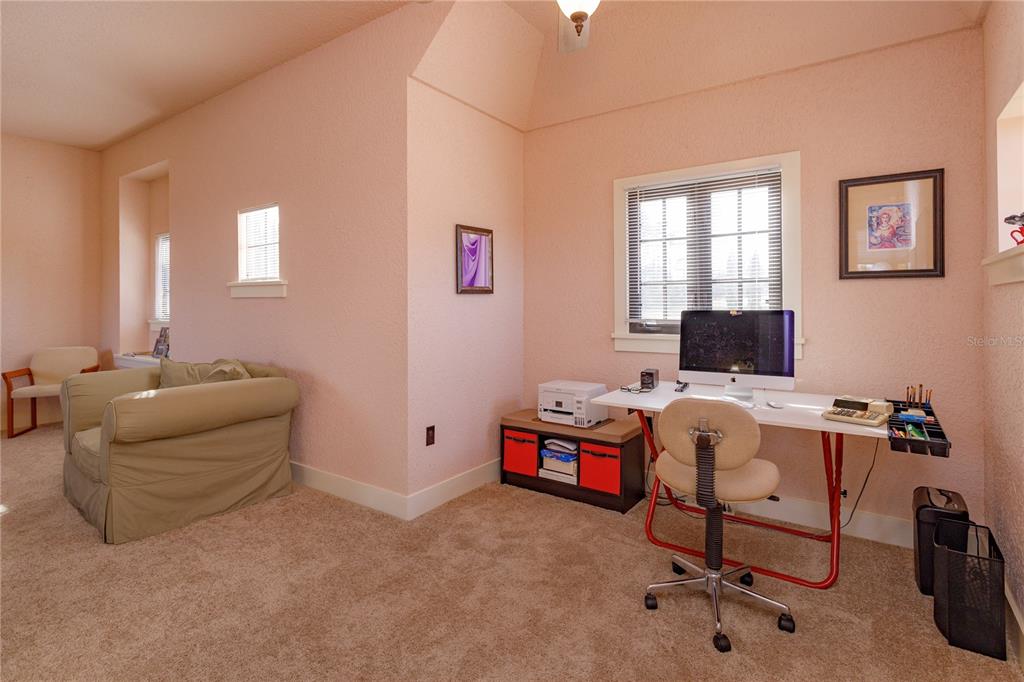 24540 Turkey Lake Road Howey-in-the-Hills, FL 34737 - Photo 27 of 42 a view of a workspace with furniture and a window