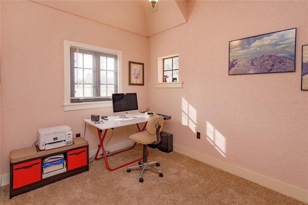 24540 Turkey Lake Road Howey-in-the-Hills, FL 34737 - Photo 28 of 42 a view of a workspace with furniture