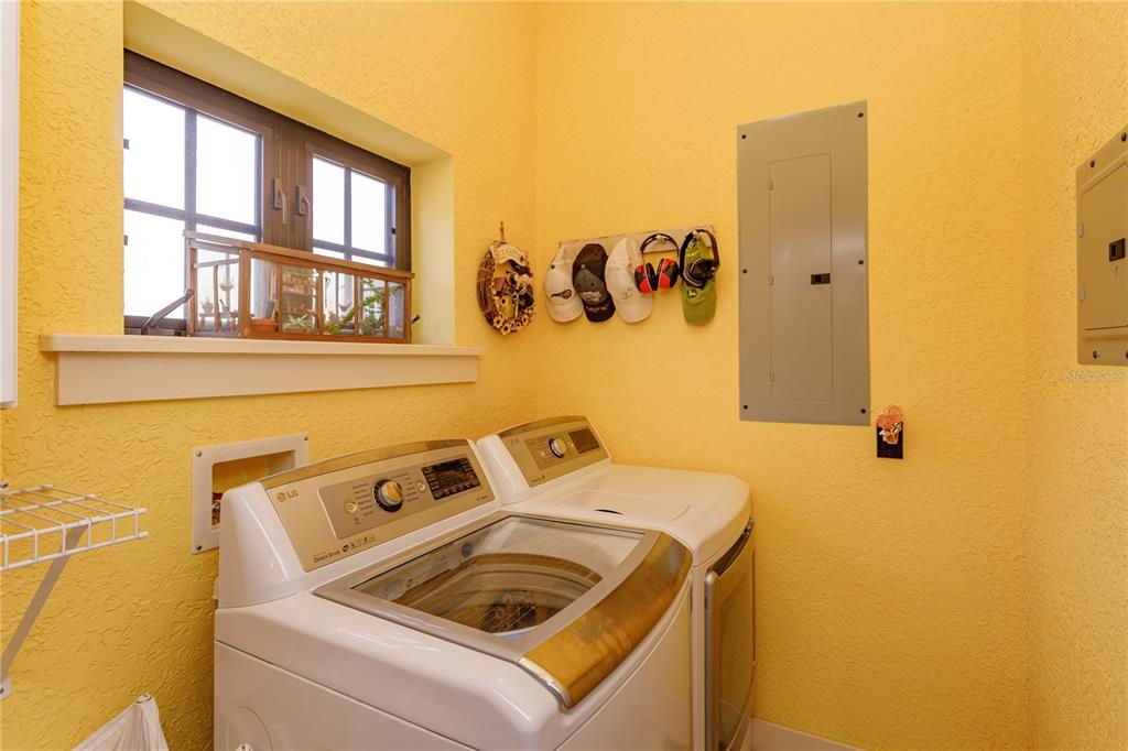 24540 Turkey Lake Road Howey-in-the-Hills, FL 34737 - Photo 32 of 42 a utility room with dryer and washer