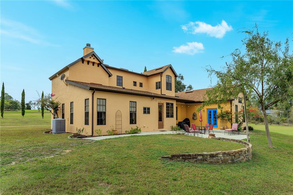 24540 Turkey Lake Road Howey-in-the-Hills, FL 34737 - Photo 36 of 42 a front view of a house with a yard