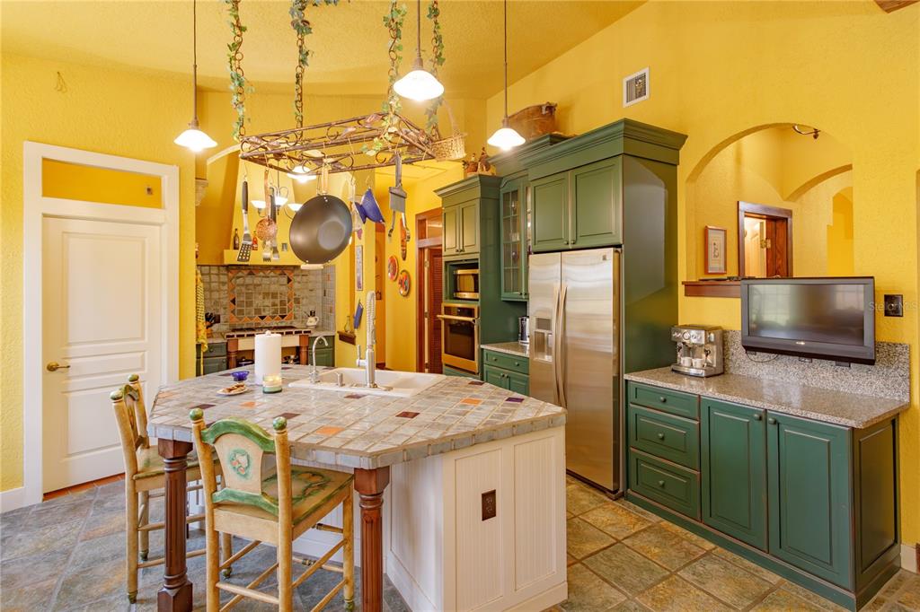 24540 Turkey Lake Road Howey-in-the-Hills, FL 34737 - Photo 8 of 42 a kitchen with a table and chairs