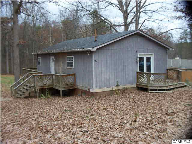 93 Logtrac Road Stanardsville, VA 22973 - Photo 1 of 20 a backyard of a house with table and chairs