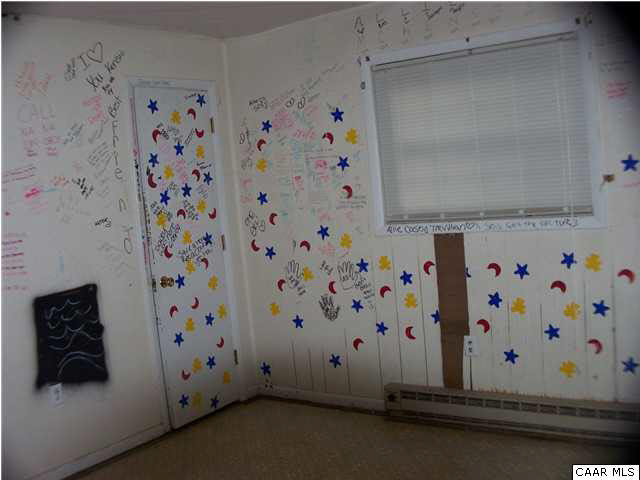 93 Logtrac Road Stanardsville, VA 22973 - Photo 8 of 20 a room with a painting on the wall and a shower curtain