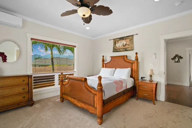 a bed sitting in a room next to a window