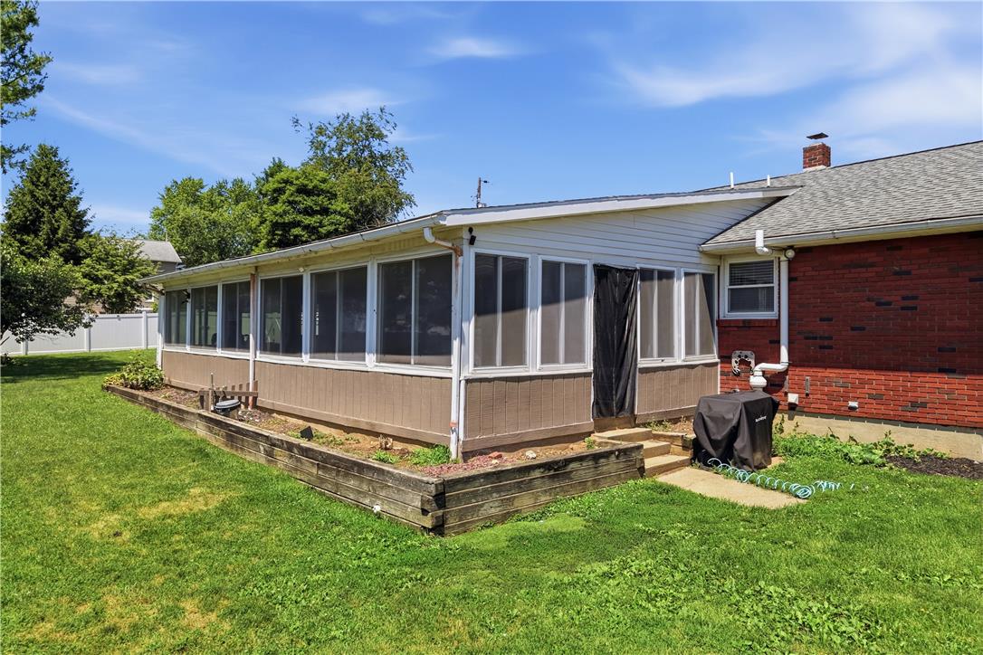 2918 Keystone Street Bethlehem, PA 18020 - Photo 39 of 54 A well-maintained screened porch with a cozy patio area invites comfortable outdoor living.