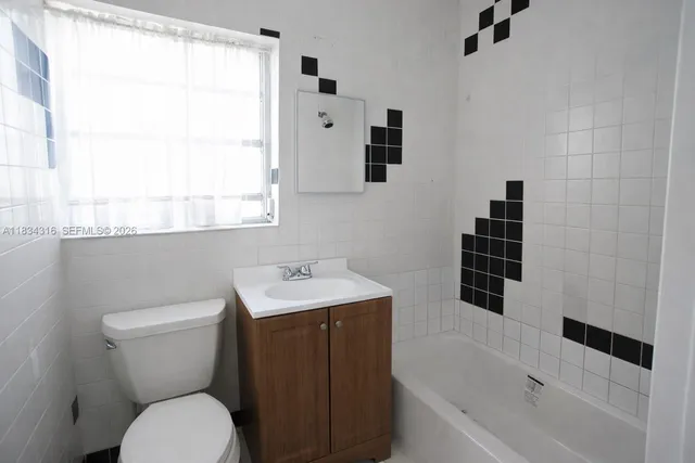 a view of a kitchen with a sink dishwasher and microwave