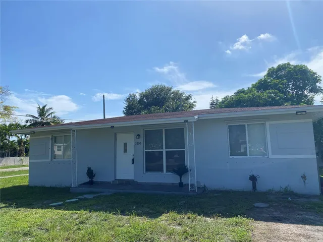 a house view with a garden space
