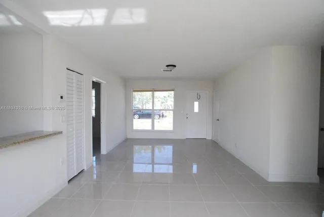 a view of an empty room and window