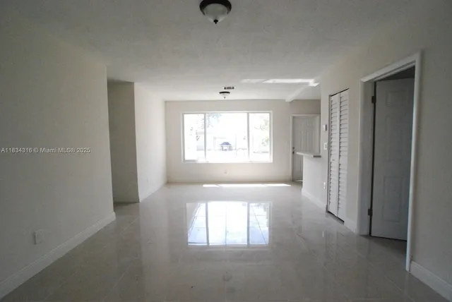 a view of a livingroom with a window