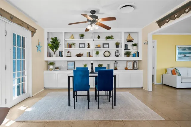 a dining room with furniture and window
