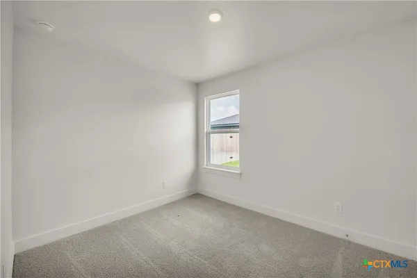 a bathroom with a granite countertop sink a toilet and bathtub