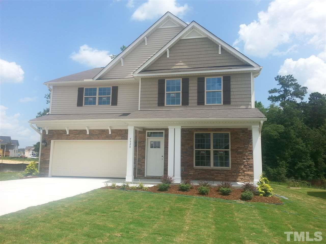 7524 Channery Way Raleigh, NC 27616 - Photo 1 of 25 a front view of a house with a yard and garage