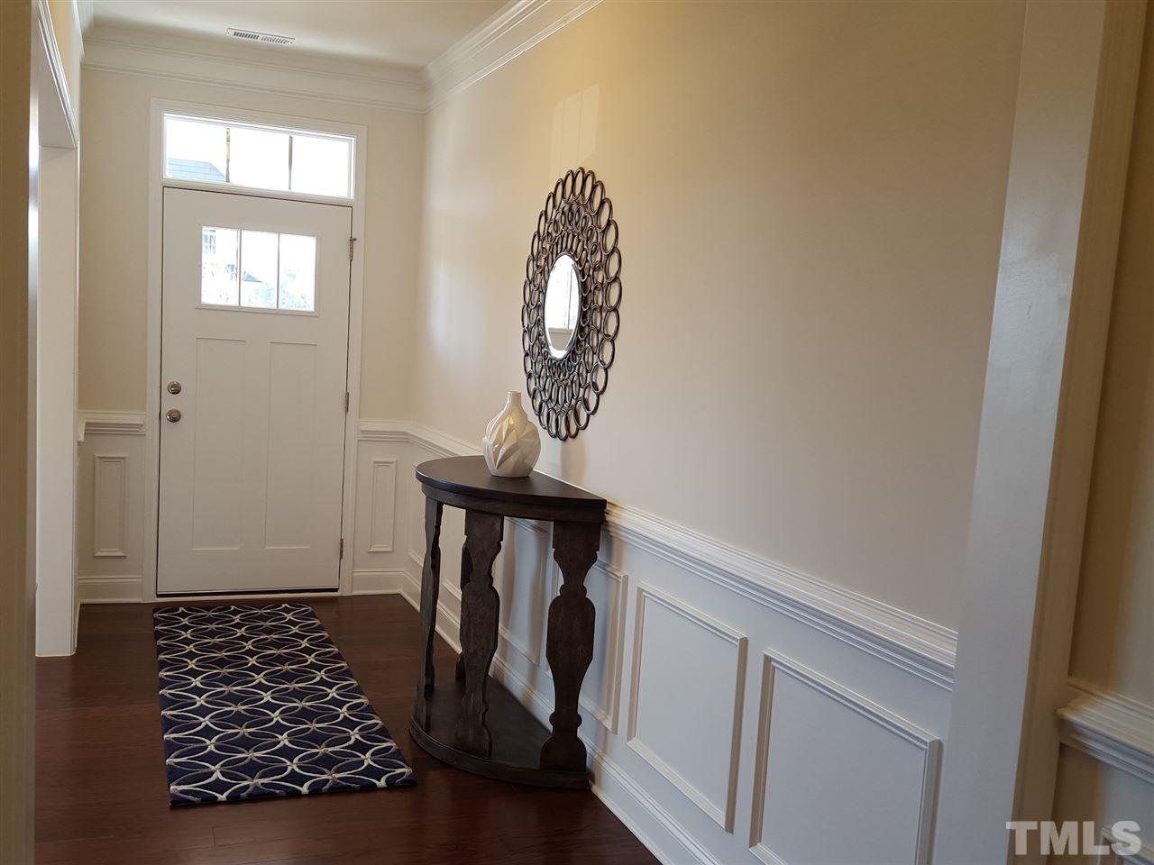 7524 Channery Way Raleigh, NC 27616 - Photo 2 of 25 a view of a entryway door with wooden floor