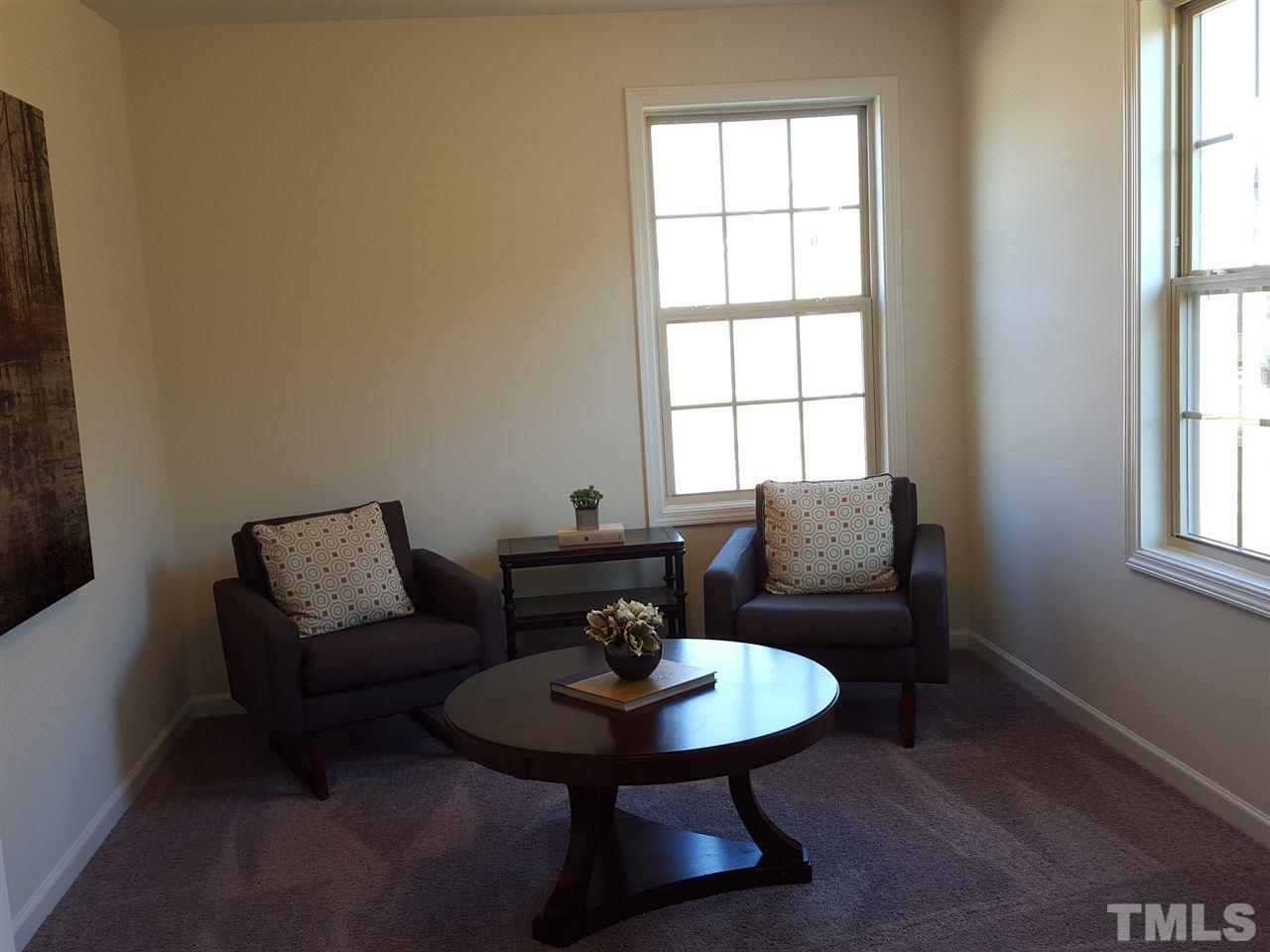 7524 Channery Way Raleigh, NC 27616 - Photo 11 of 25 a living room with furniture and a window