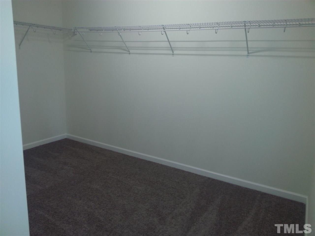 7524 Channery Way Raleigh, NC 27616 - Photo 14 of 25 a view of a room with racks on the wall