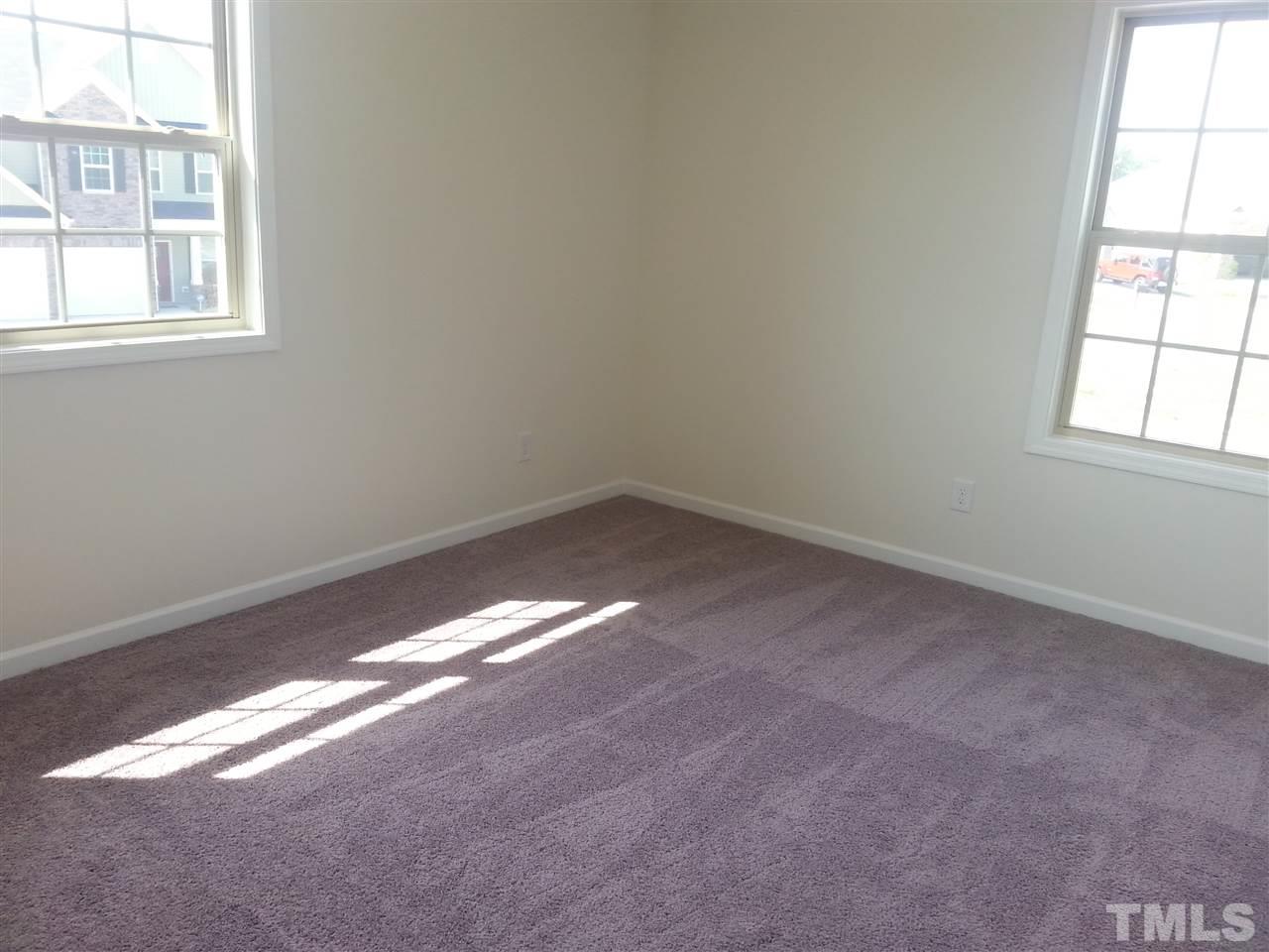 7524 Channery Way Raleigh, NC 27616 - Photo 19 of 25 an empty room with a window