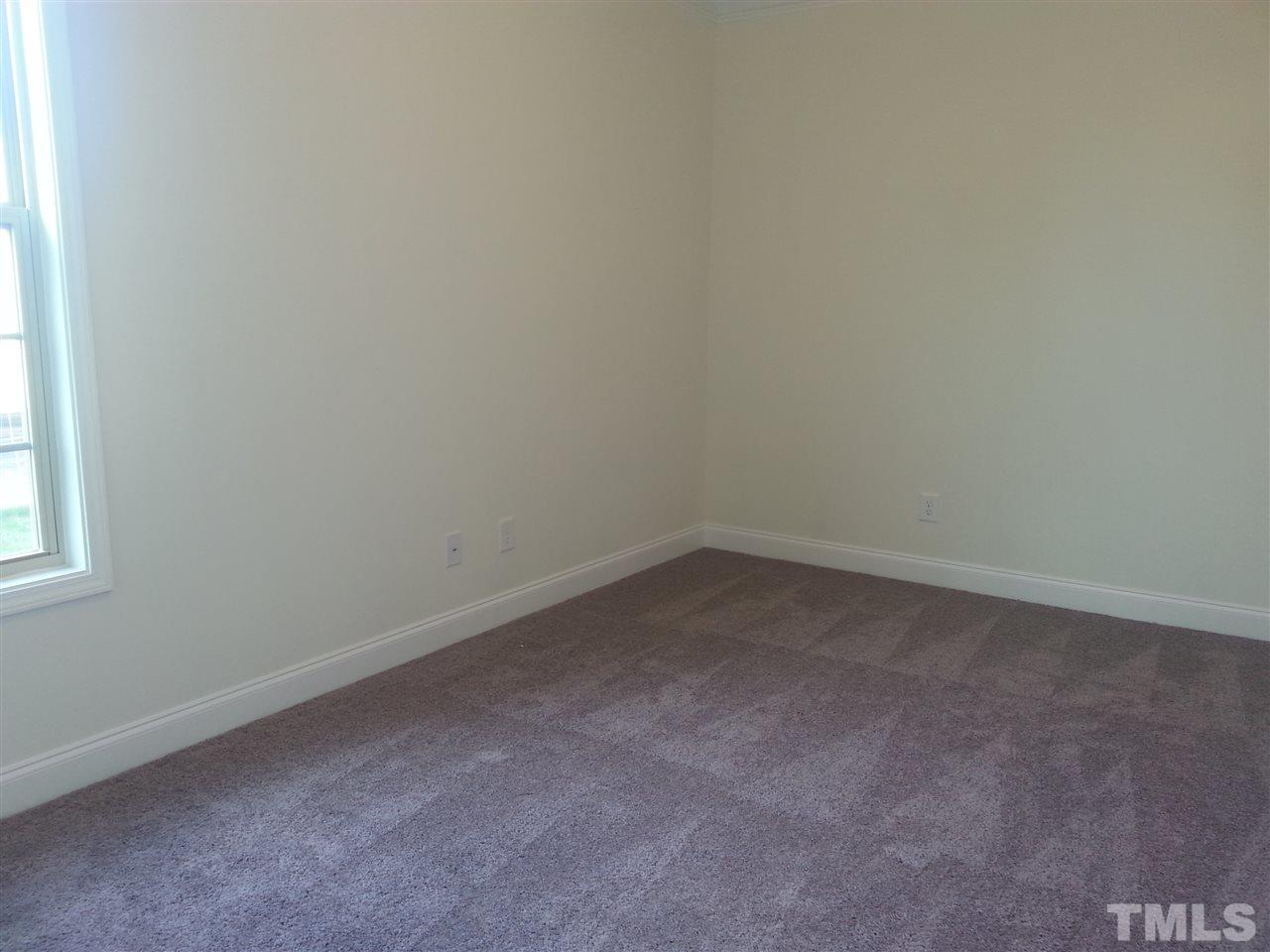 7524 Channery Way Raleigh, NC 27616 - Photo 21 of 25 a room that has a window in it