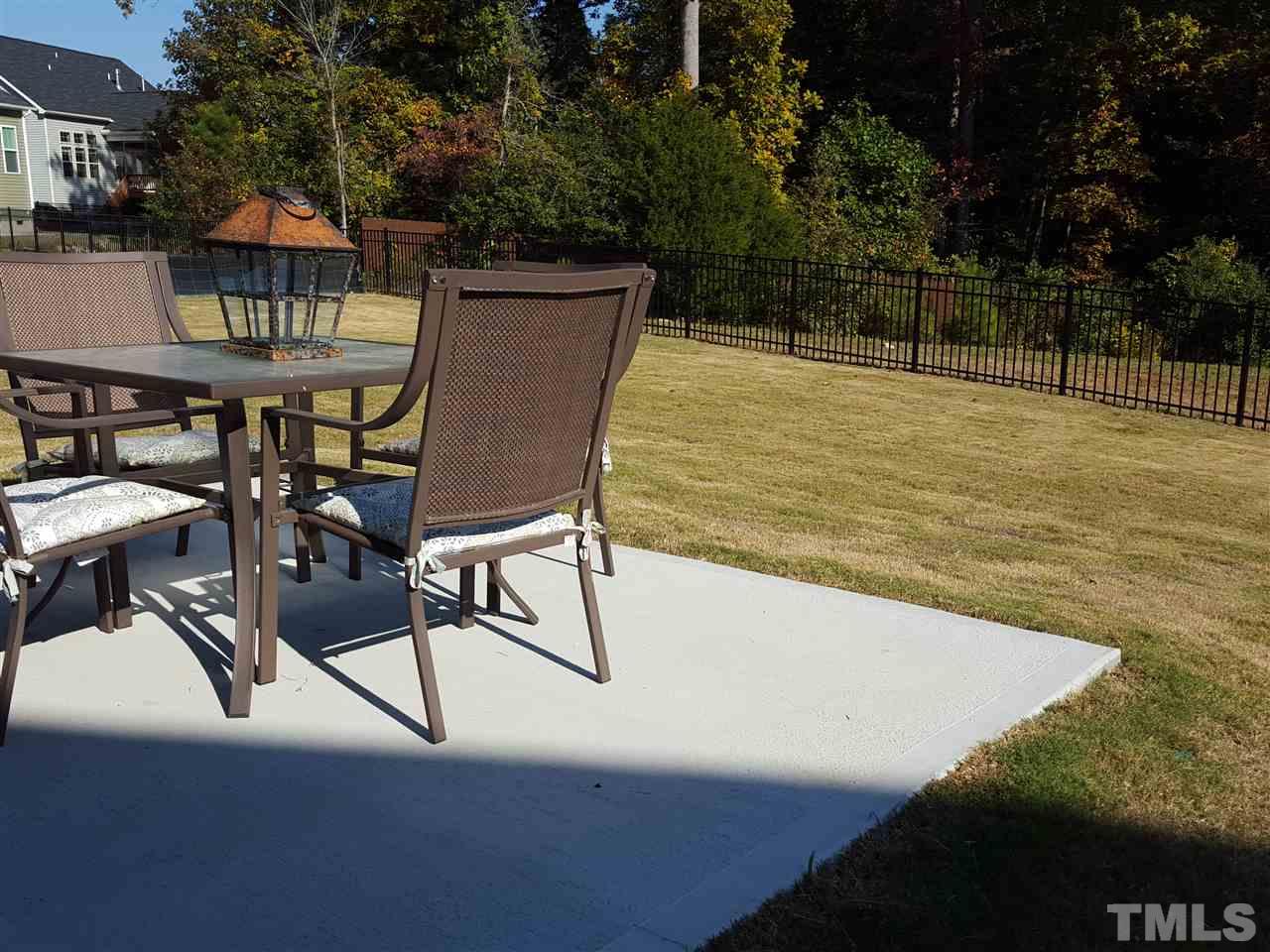 7524 Channery Way Raleigh, NC 27616 - Photo 22 of 25 a swimming pool with outdoor seating and yard
