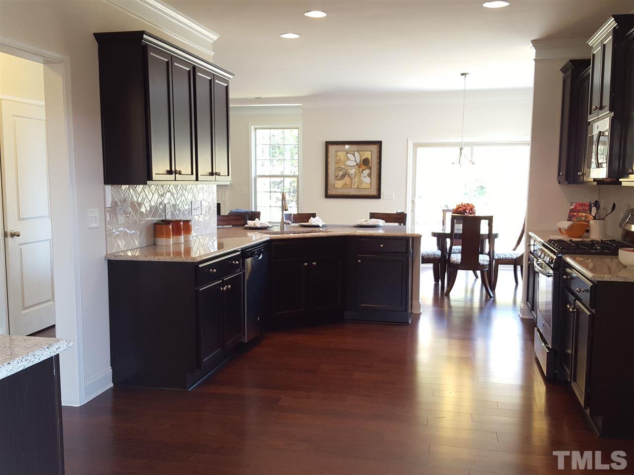 7524 Channery Way Raleigh, NC 27616 - Photo 4 of 25 a kitchen with lots of counter top space