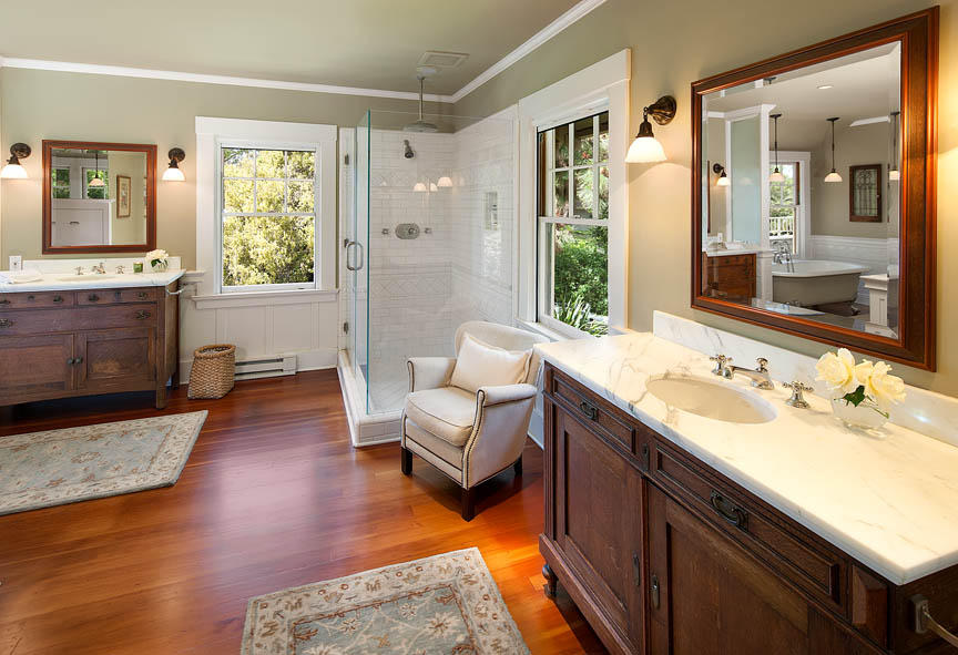 680 Ashley Road Montecito, CA 93108 - Photo 12 of 18 a spacious bathroom with a double vanity sink and a large mirror