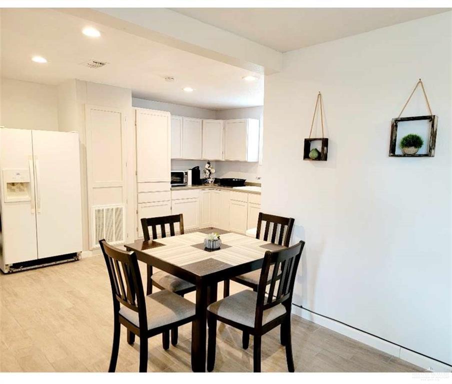 906 East Van Week Street Edinburg, TX 78541 - Photo 12 of 19 a view of a dining room with furniture
