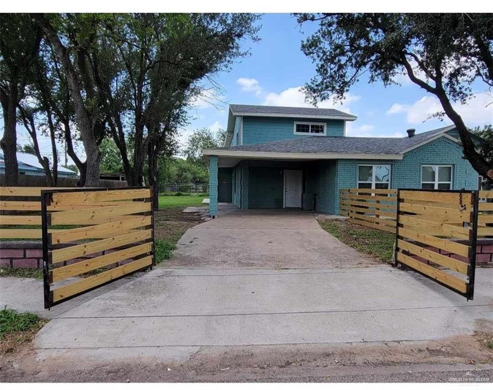 906 East Van Week Street Edinburg, TX 78541 - Photo 7 of 19 a front view of a house with a garage