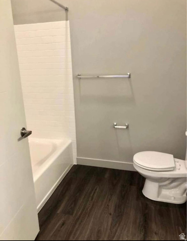 618 South 100 West, Unit 303 Springville, UT 84663 - Photo 8 of 11 Tub and shower combination with white subway tile surround, wood-finish flooring, and a white toilet