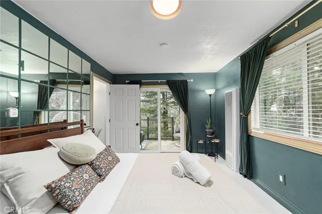 a bedroom with furniture and windows