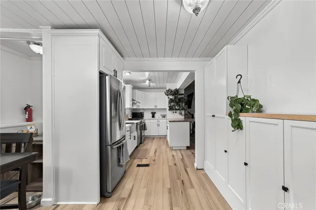 a view of a kitchen from the hallway
