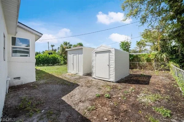 a view of a house with a yard and garage
