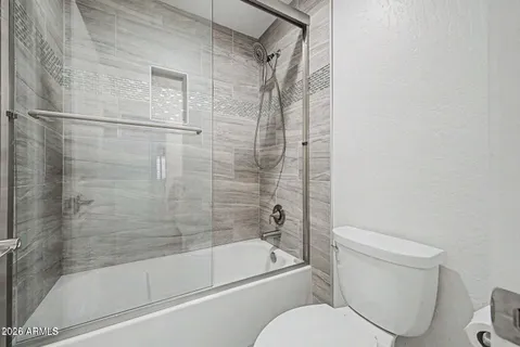 a utility room with sink dryer and washer