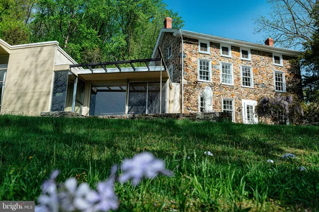 a view of yard with swimming pool and green space